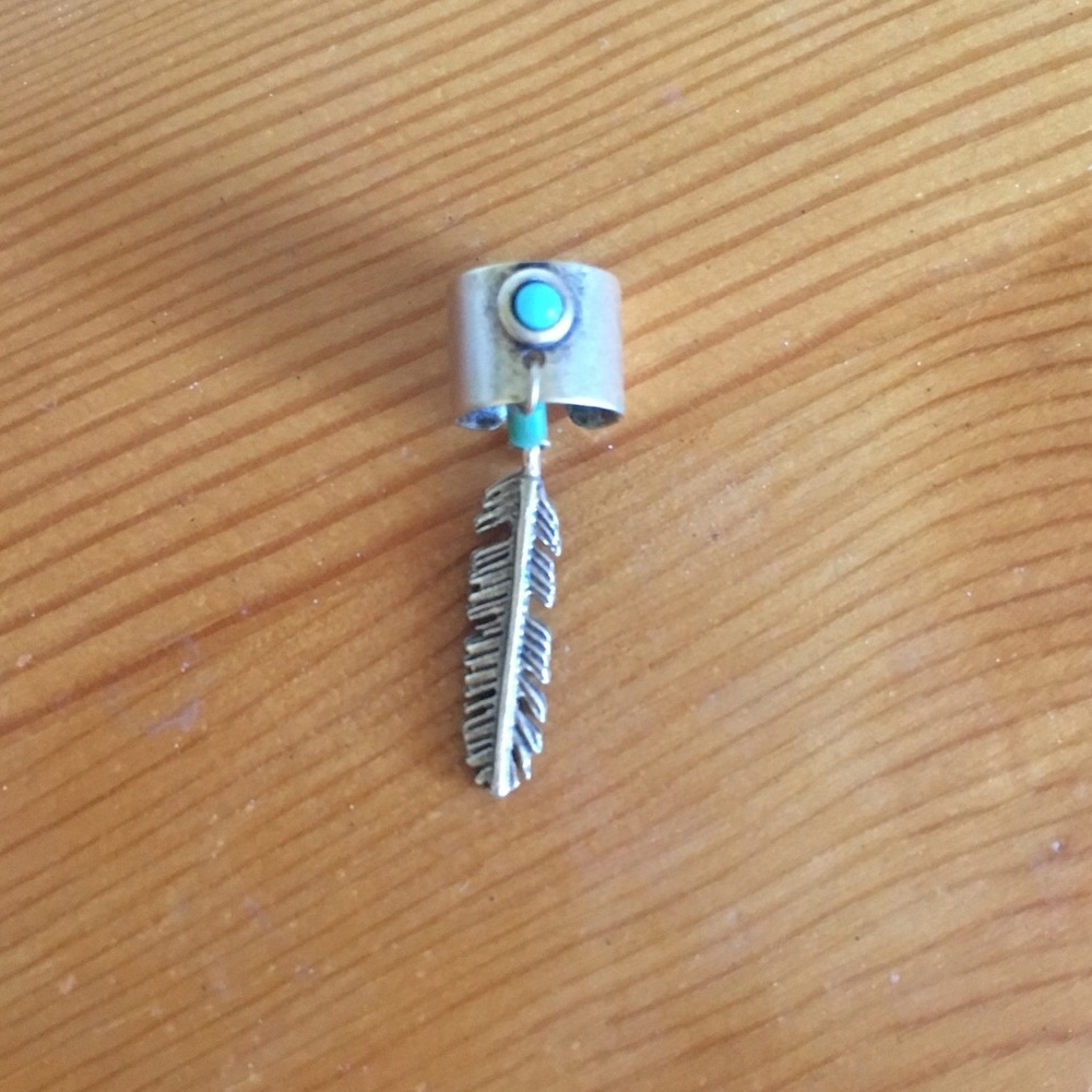 Urban Outfitters ear cuff with feather charm